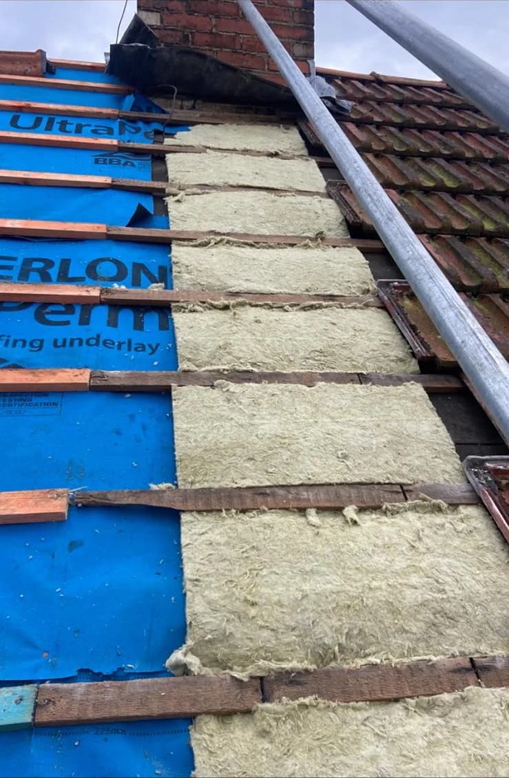 Breathable roofing membrane and battens with insulation between rafters